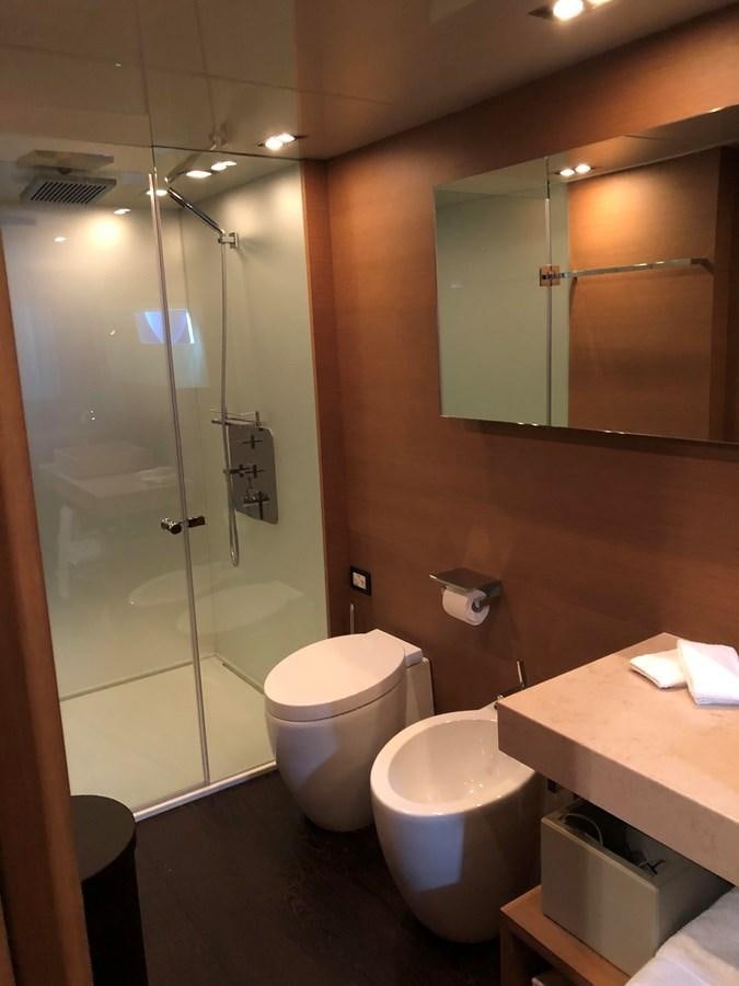 a bathroom with a glass shower door aboard IL GATTOPARDO Yacht for Sale