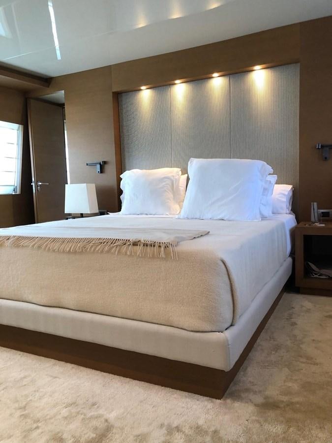 a bed with white sheets aboard IL GATTOPARDO Yacht for Sale