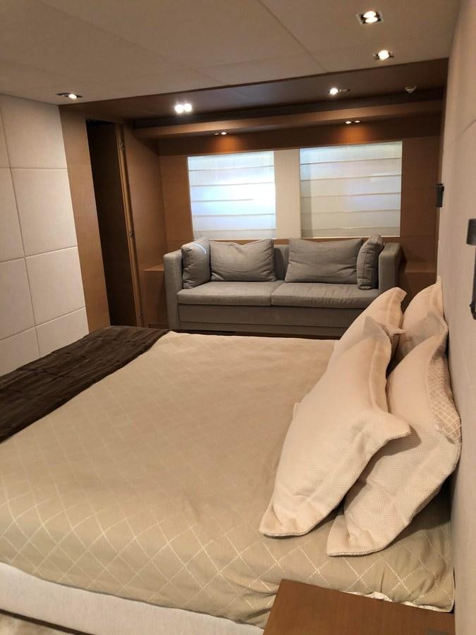 a couch and a bed in a room aboard IL GATTOPARDO Yacht for Sale