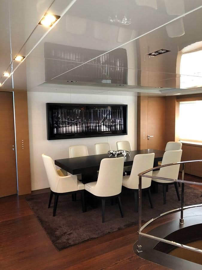 a room with tables and chairs aboard IL GATTOPARDO Yacht for Sale