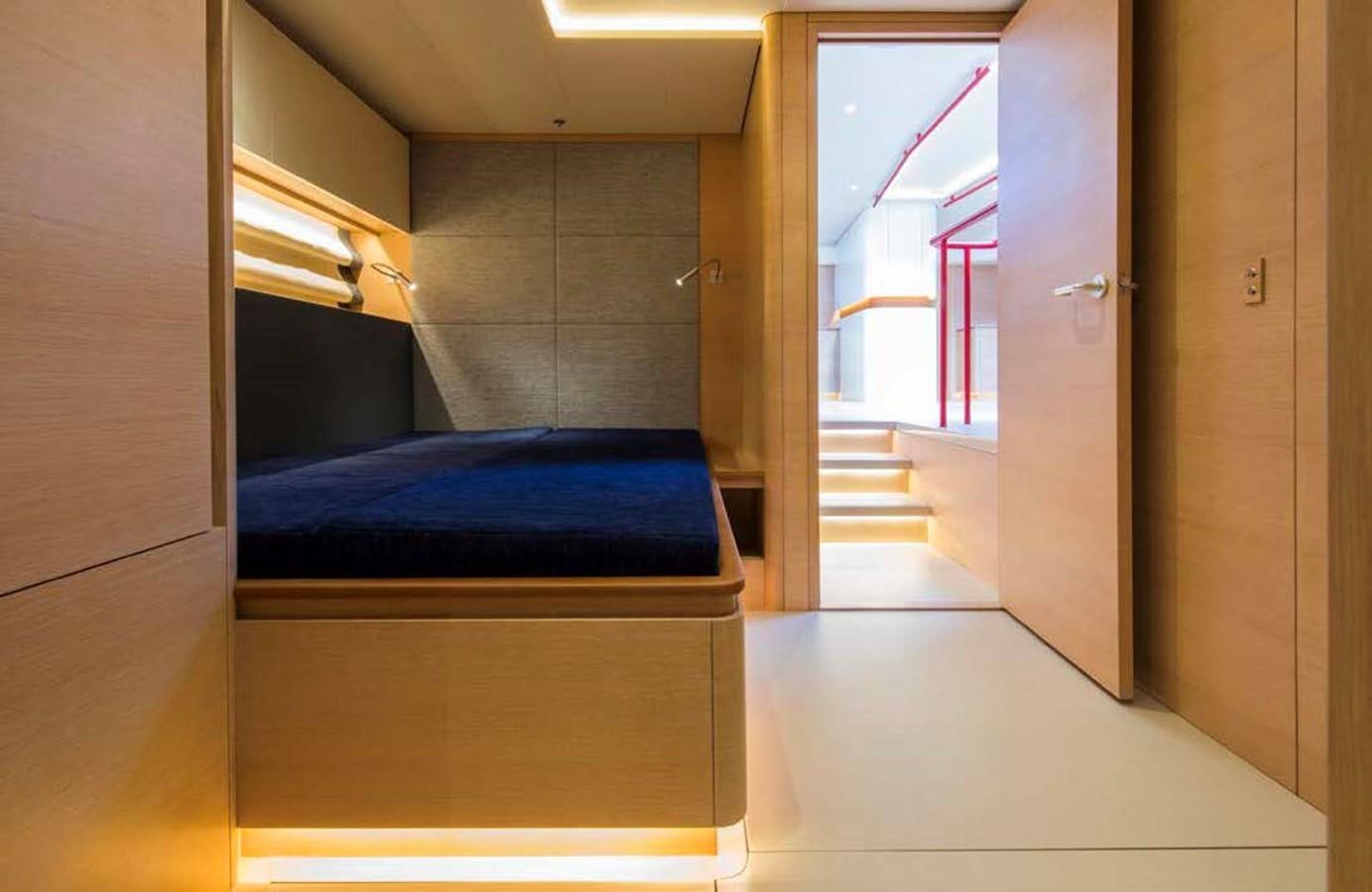 a hallway with a bed and a blue bed aboard HIGHLAND FLING 15 Yacht for Sale