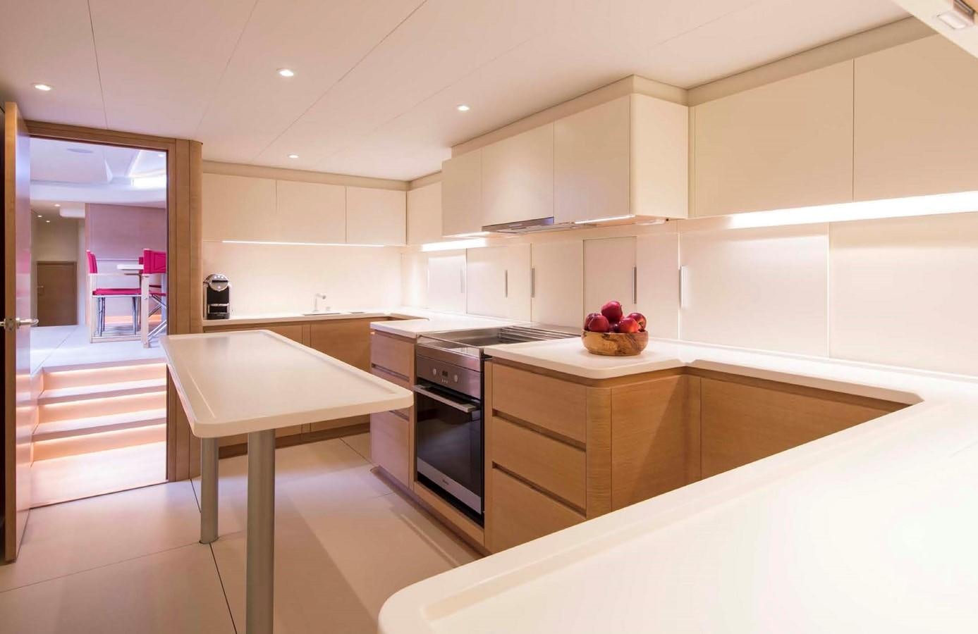 a kitchen with white cabinets aboard HIGHLAND FLING 15 Yacht for Sale