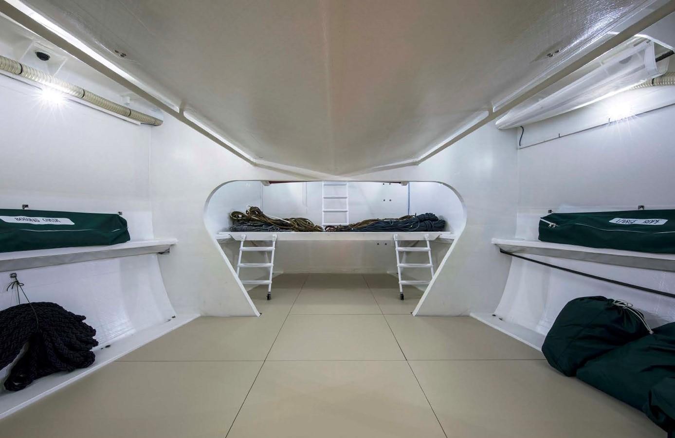 a room with white walls and white furniture aboard HIGHLAND FLING 15 Yacht for Sale