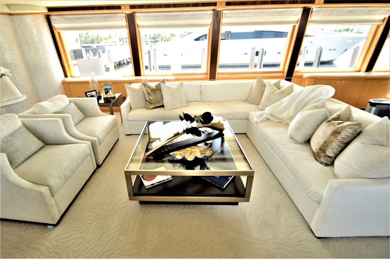 a living room with a couch and a coffee table aboard MISS STEPHANIE  Yacht for Sale