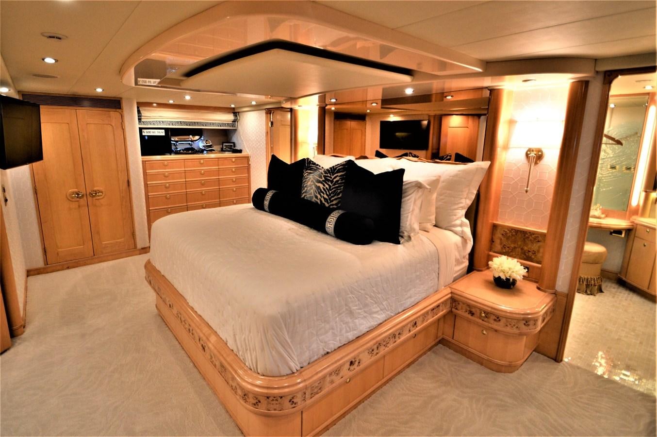 a large bed in a room aboard MISS STEPHANIE  Yacht for Sale