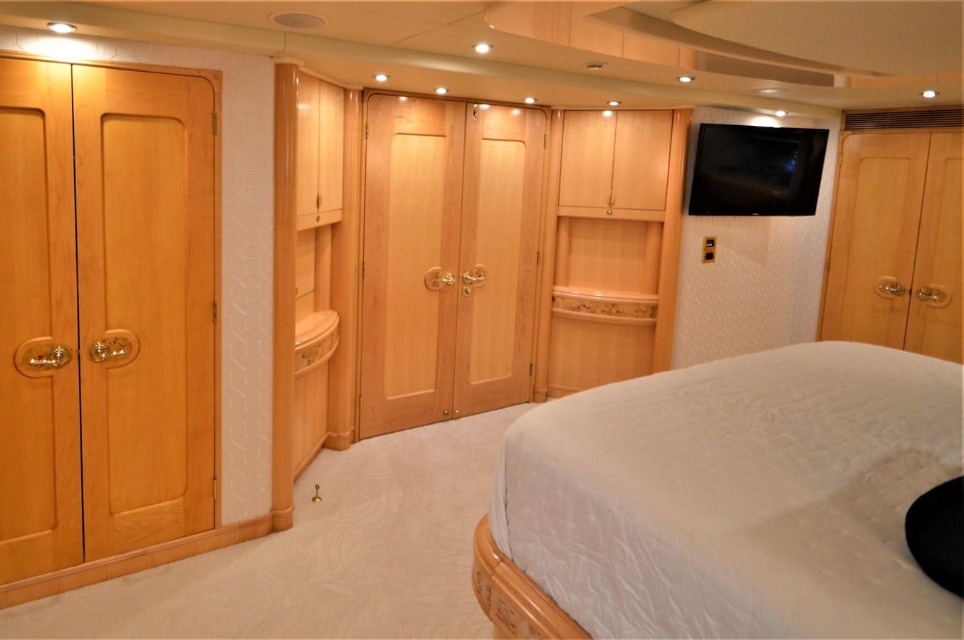 a room with a bed and a television aboard MISS STEPHANIE  Yacht for Sale