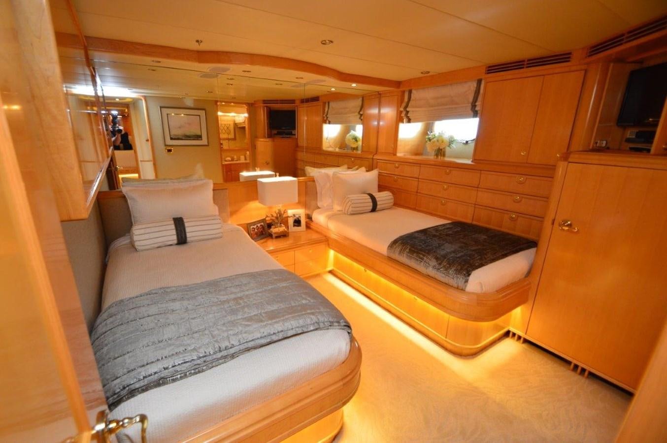 a room with a bed and a chair aboard MISS STEPHANIE  Yacht for Sale