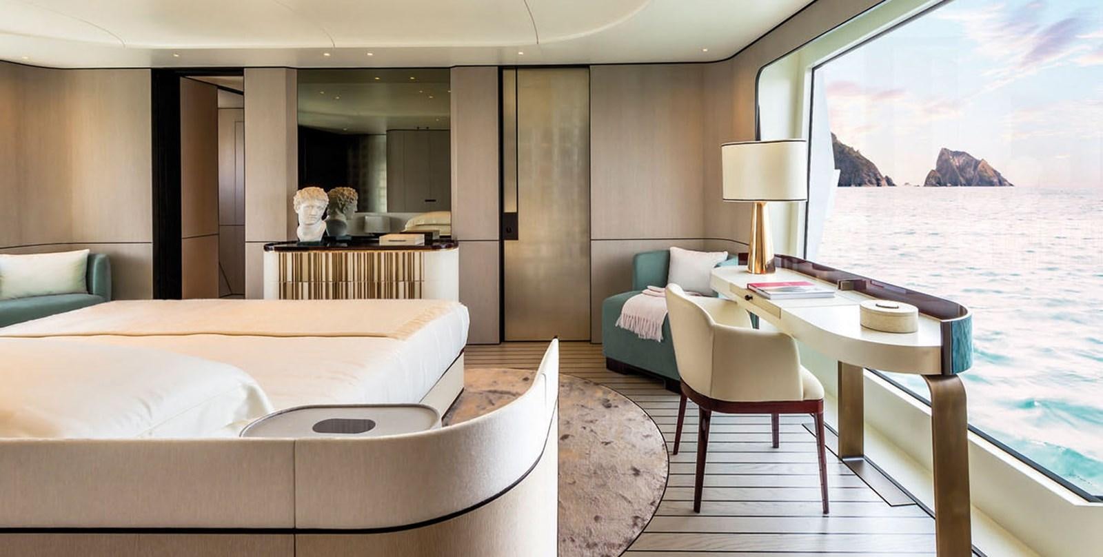 a room with a bed and a table and chairs aboard VICIOUS RUMOUR II Yacht for Sale