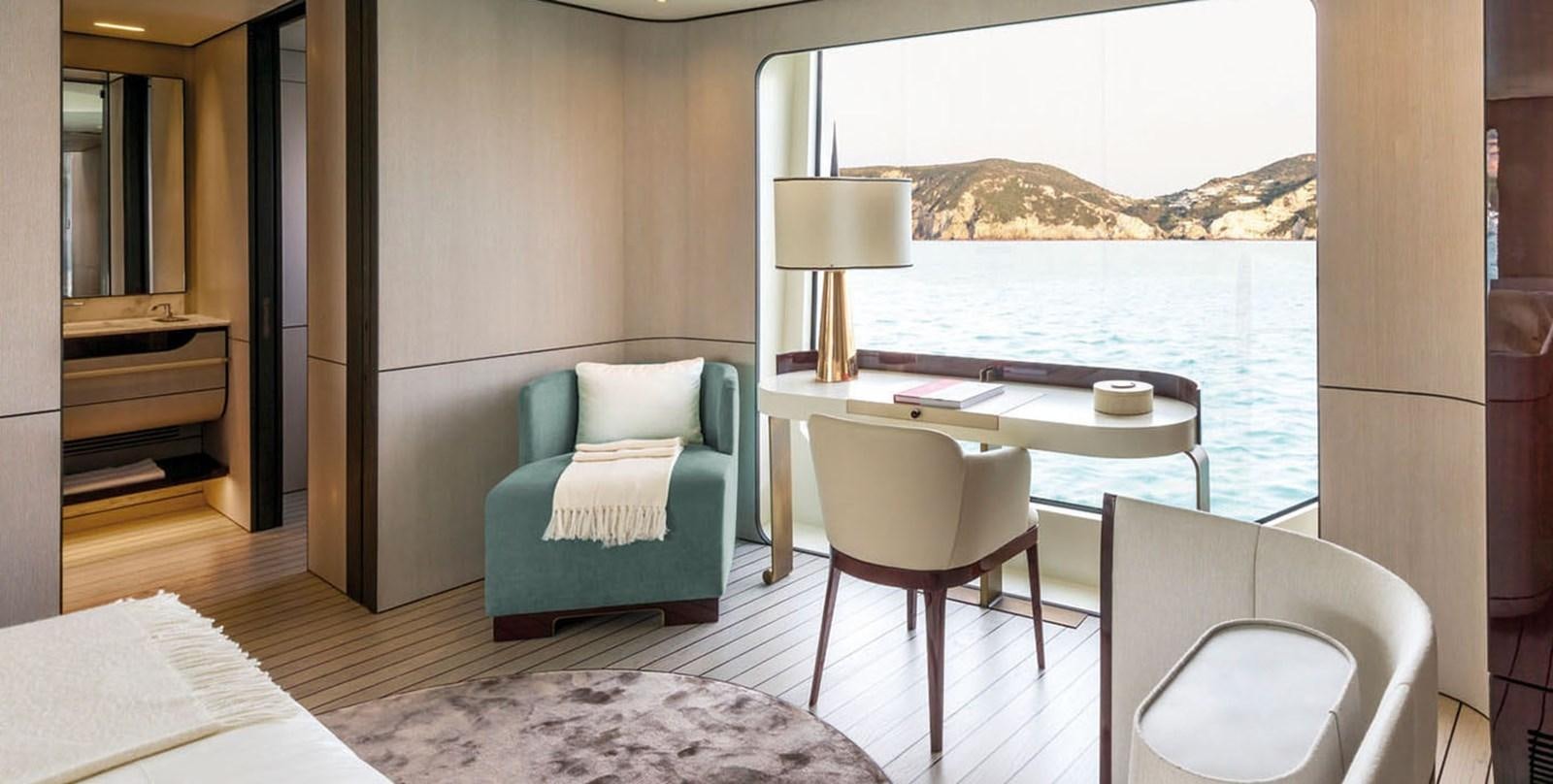 a room with a table and chairs aboard VICIOUS RUMOUR II Yacht for Sale