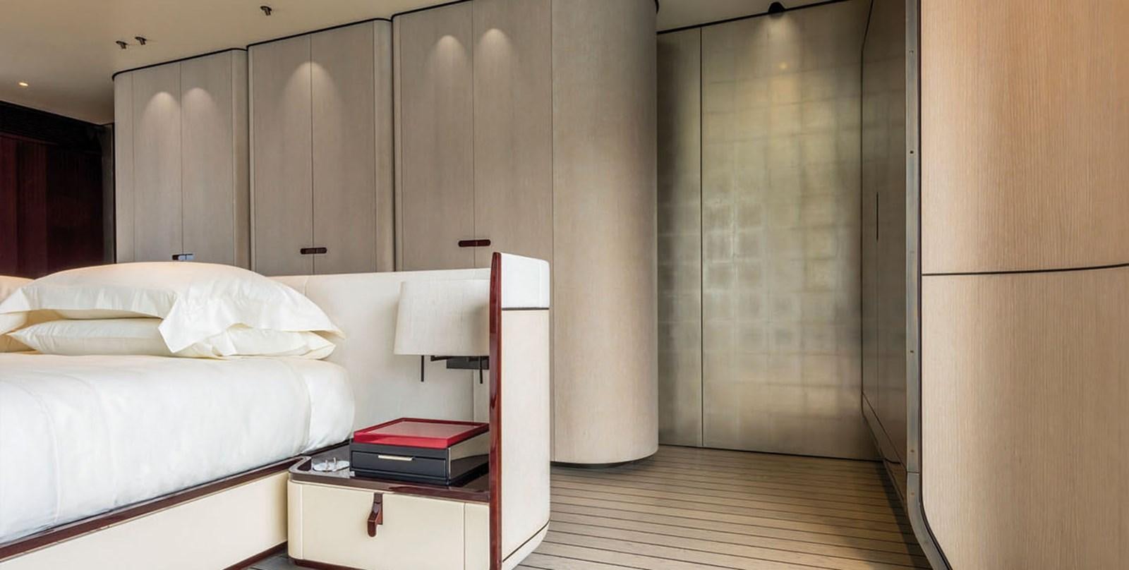 a room with a bed and a desk aboard VICIOUS RUMOUR II Yacht for Sale