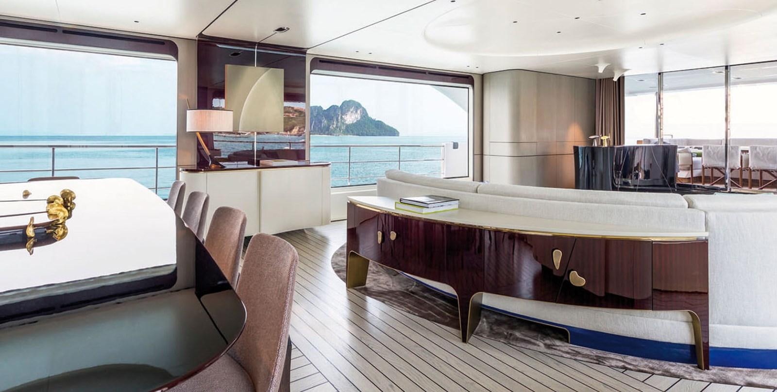 a room with a large table and chairs aboard VICIOUS RUMOUR II Yacht for Sale