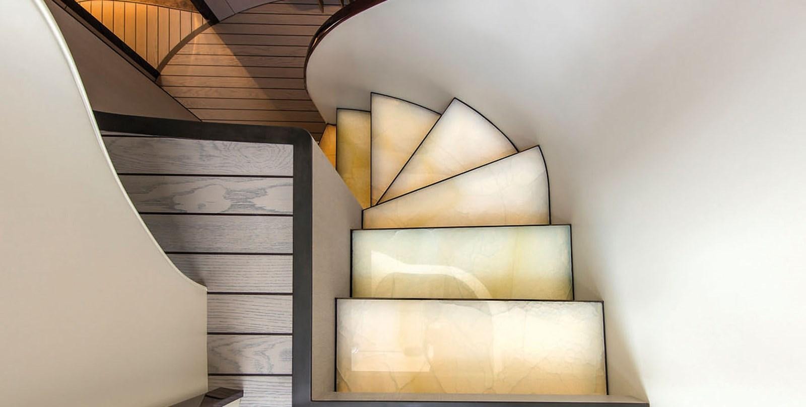 a staircase with a glass window aboard VICIOUS RUMOUR II Yacht for Sale