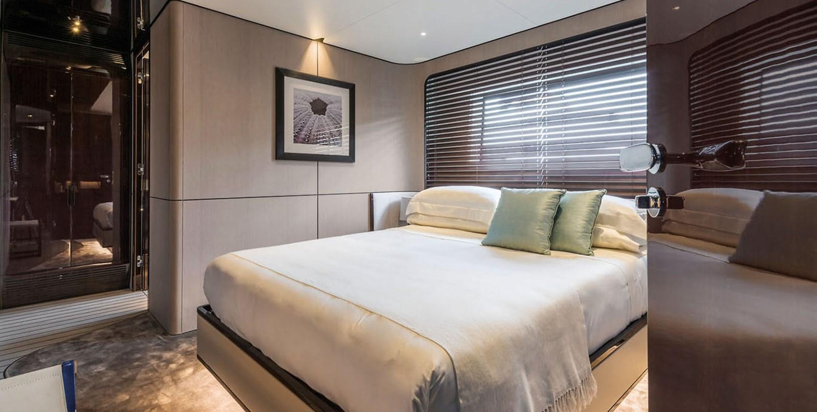a room with a bed and a window aboard VICIOUS RUMOUR II Yacht for Sale