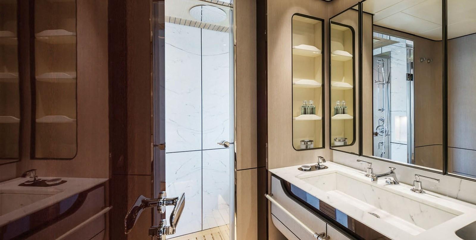a bathroom with a large mirror aboard VICIOUS RUMOUR II Yacht for Sale