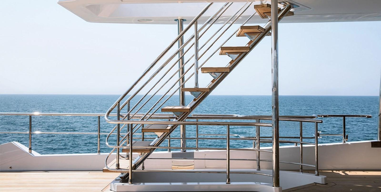 a large metal staircase on a boat aboard VICIOUS RUMOUR II Yacht for Sale