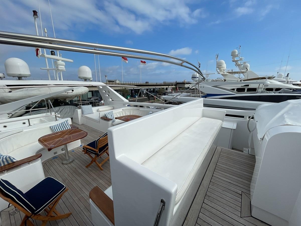 a deck of a boat with a deck and chairs on it aboard GAUDEAMUS Yacht for Sale