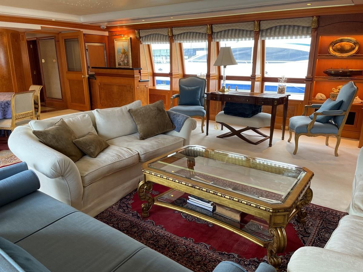a living room with a large window aboard GAUDEAMUS Yacht for Sale