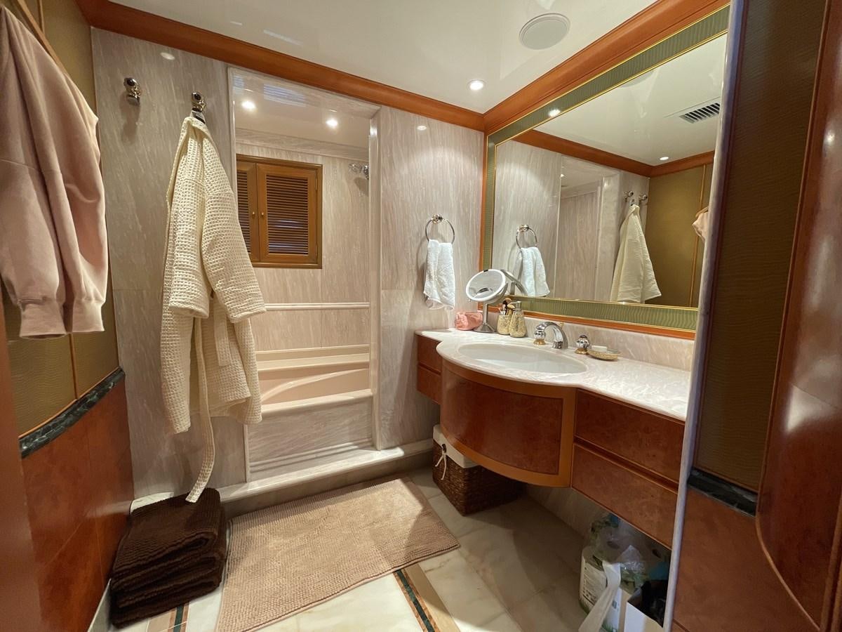 a bathroom with a large mirror aboard GAUDEAMUS Yacht for Sale