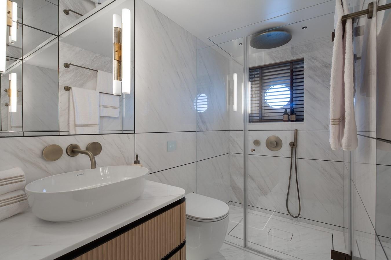 a bathroom with a sink and a toilet aboard MOONEN 110 MUSTIQUE Yacht for Sale