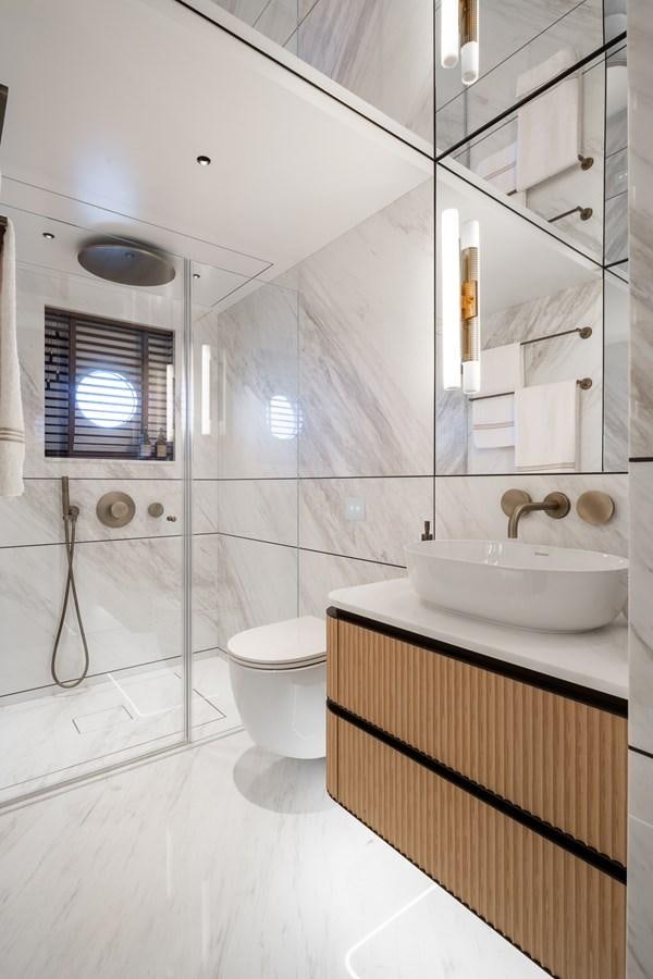 a bathroom with a sink and toilet aboard MOONEN 110 MUSTIQUE Yacht for Sale
