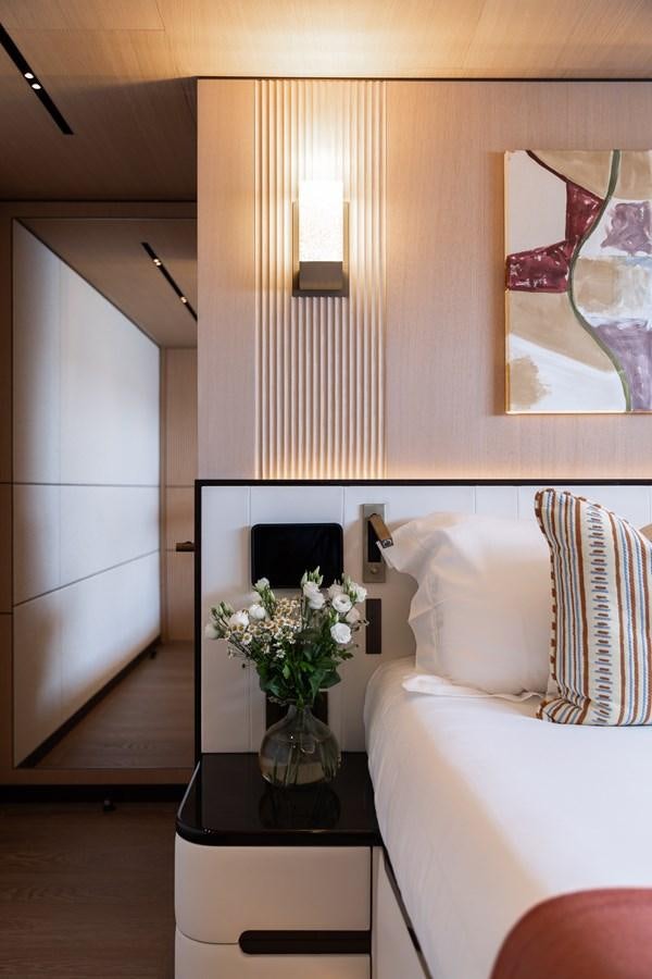 a vase of flowers on a table aboard MOONEN 110 MUSTIQUE Yacht for Sale