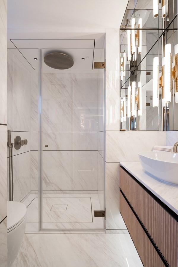 a bathroom with a shower unit aboard MOONEN 110 MUSTIQUE Yacht for Sale