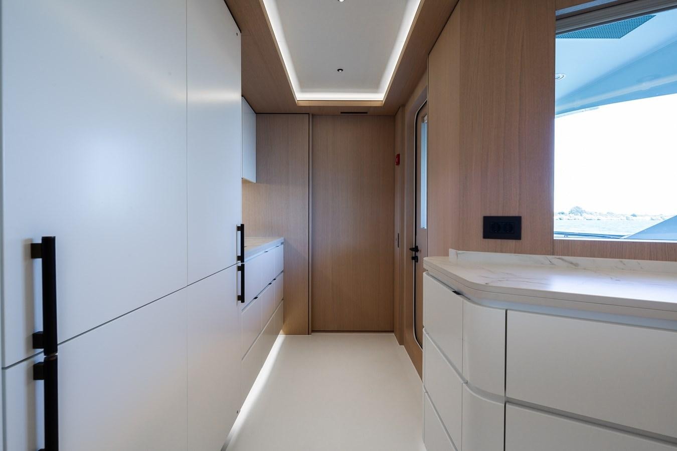 a room with a window and a sink aboard MOONEN 110 MUSTIQUE Yacht for Sale