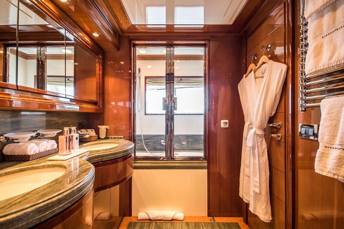 a bathroom with a large window aboard QUEEN OF SHEBA Yacht for Sale