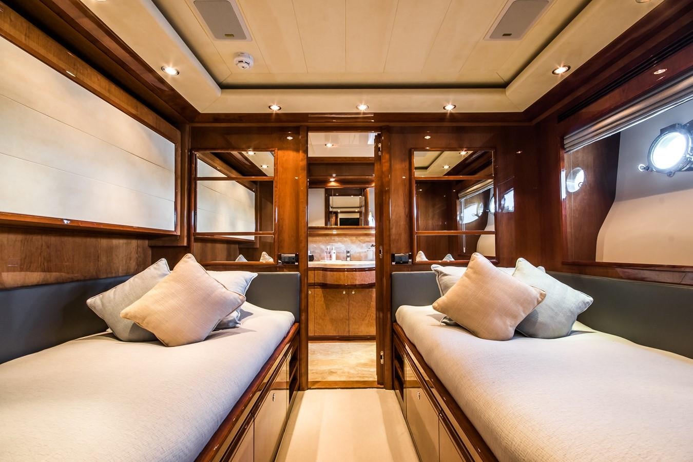 a room with a bed and a mirror aboard QUEEN OF SHEBA Yacht for Sale