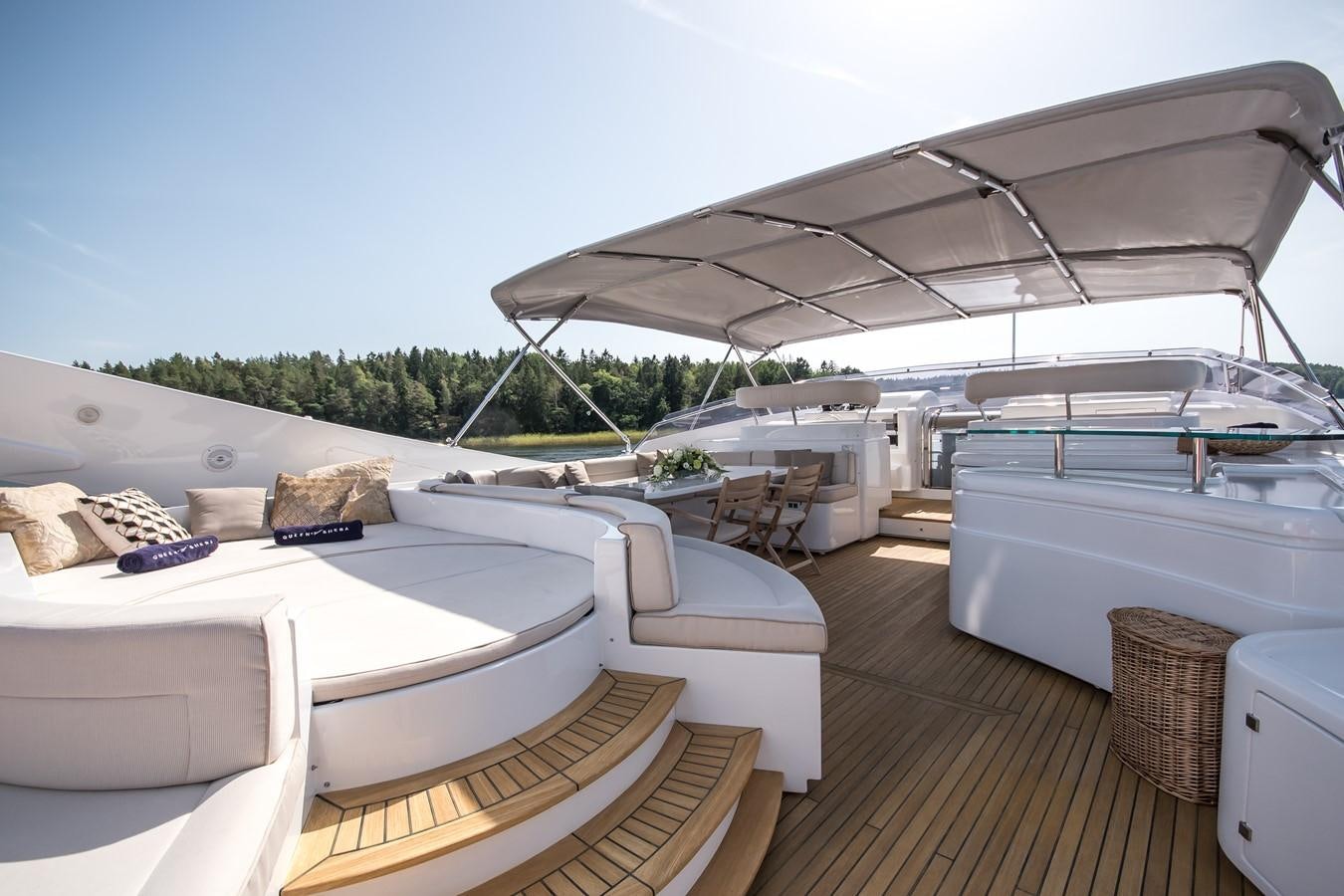 a boat with a deck and chairs aboard QUEEN OF SHEBA Yacht for Sale