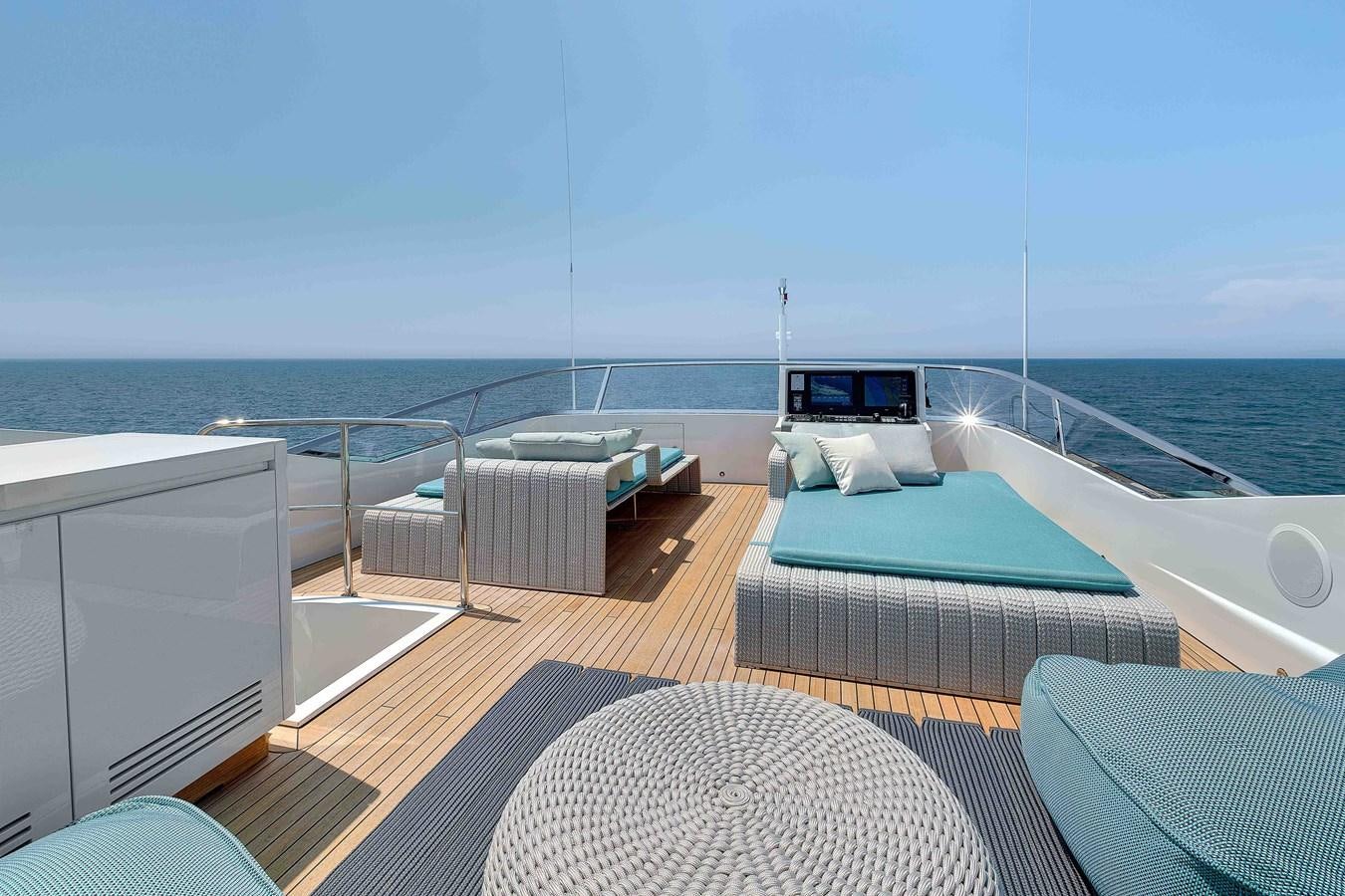a balcony with a bed and a pool aboard MANGUSTA 110 - CAREFULLY USED Yacht for Sale