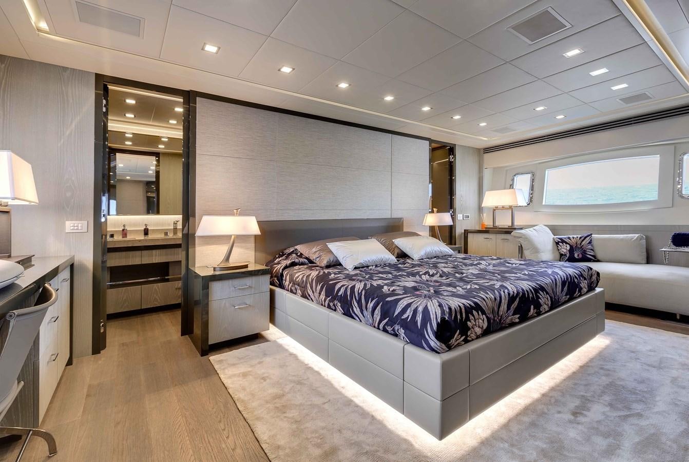 a large bedroom with a large bed aboard MANGUSTA 110 - CAREFULLY USED Yacht for Sale