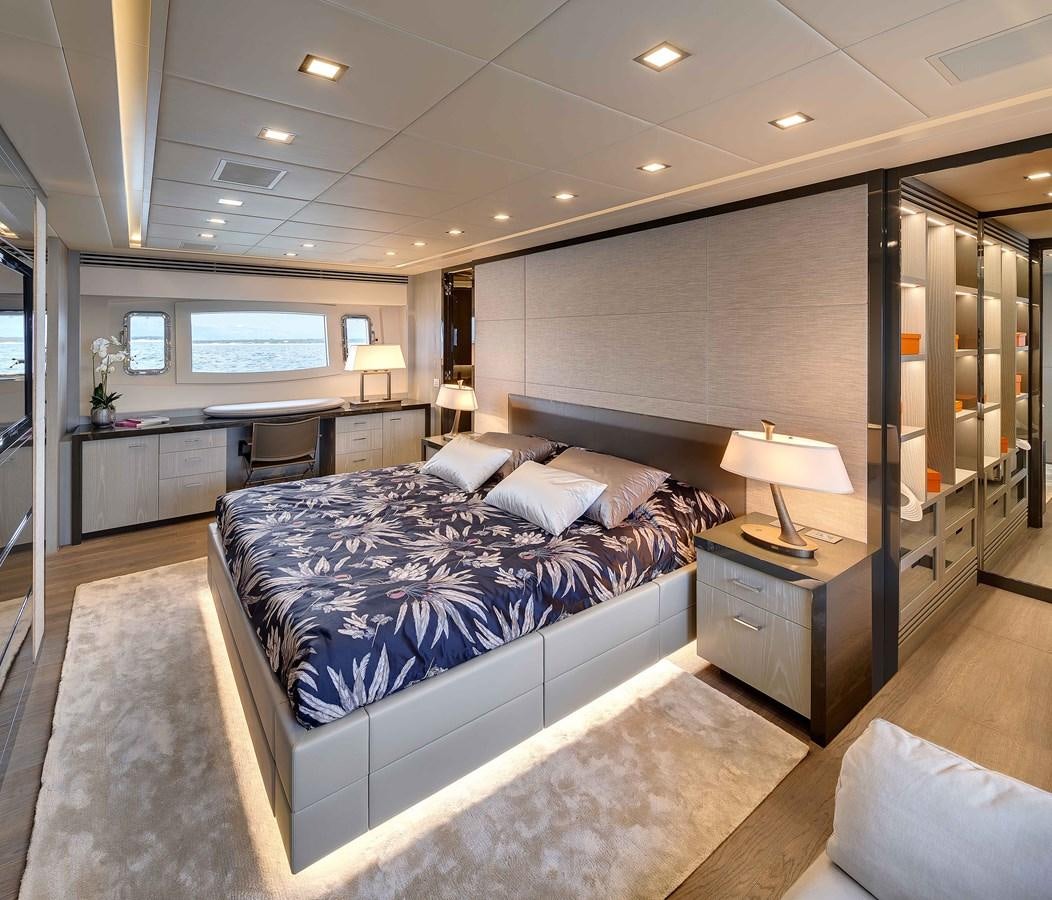 a bedroom with a large bed aboard MANGUSTA 110 - CAREFULLY USED Yacht for Sale