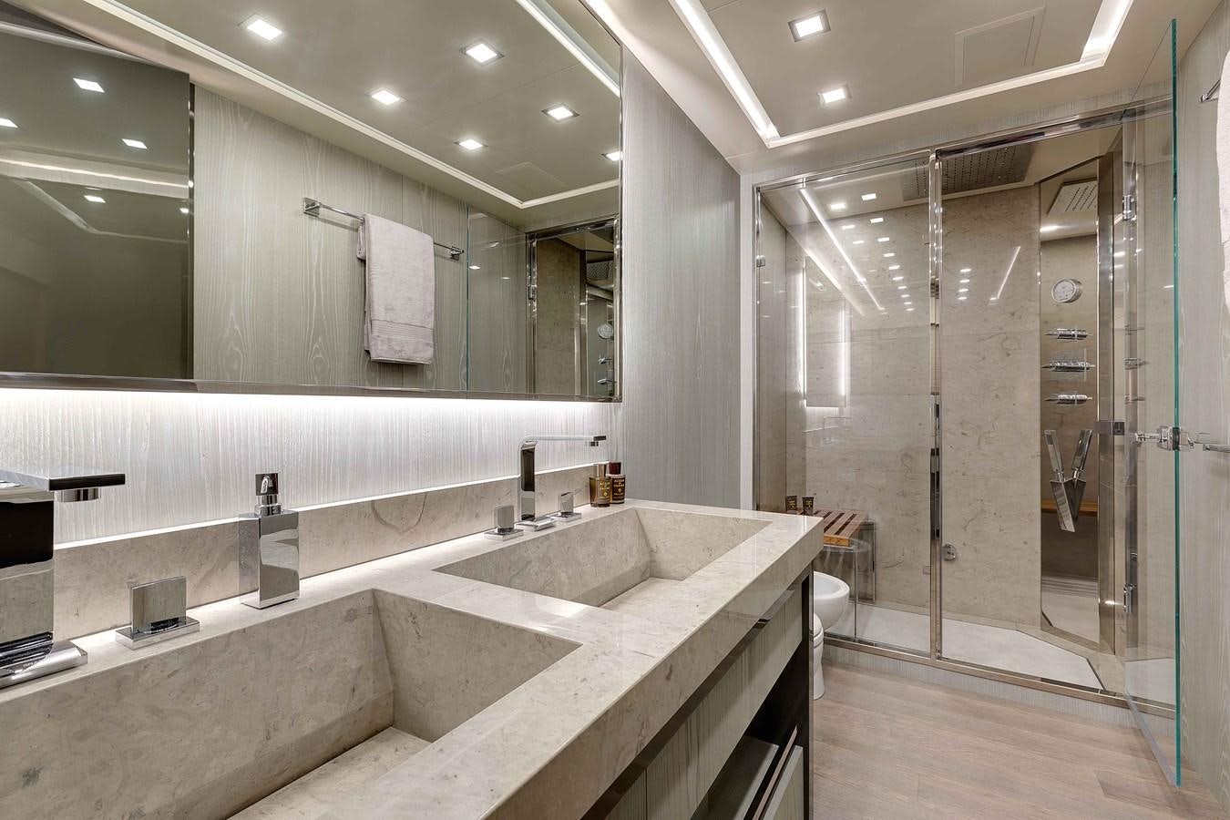 a bathroom with a large countertop aboard MANGUSTA 110 - CAREFULLY USED Yacht for Sale