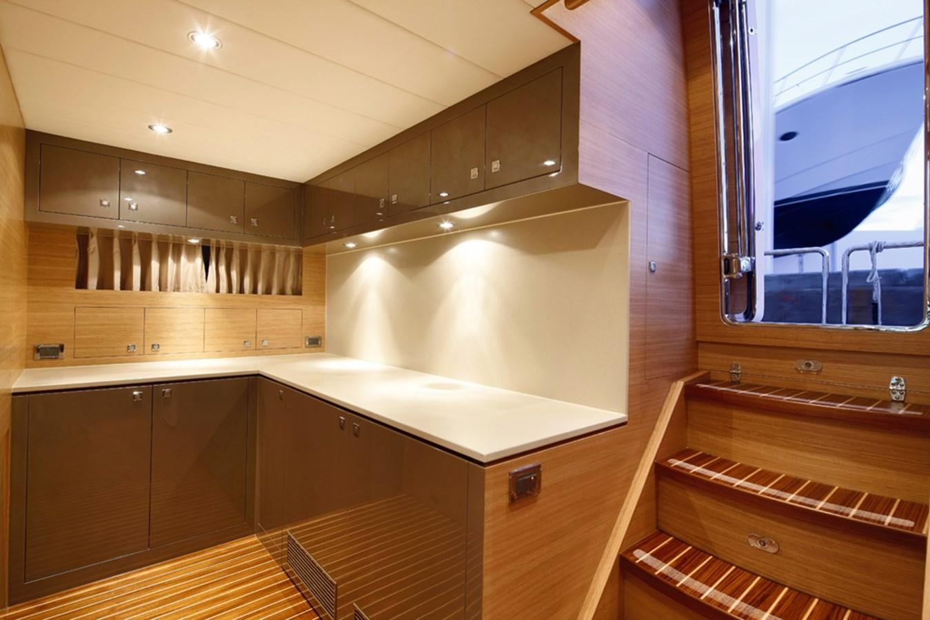 a kitchen with wooden cabinets aboard P110 (NEW BOAT SPEC)  Yacht for Sale