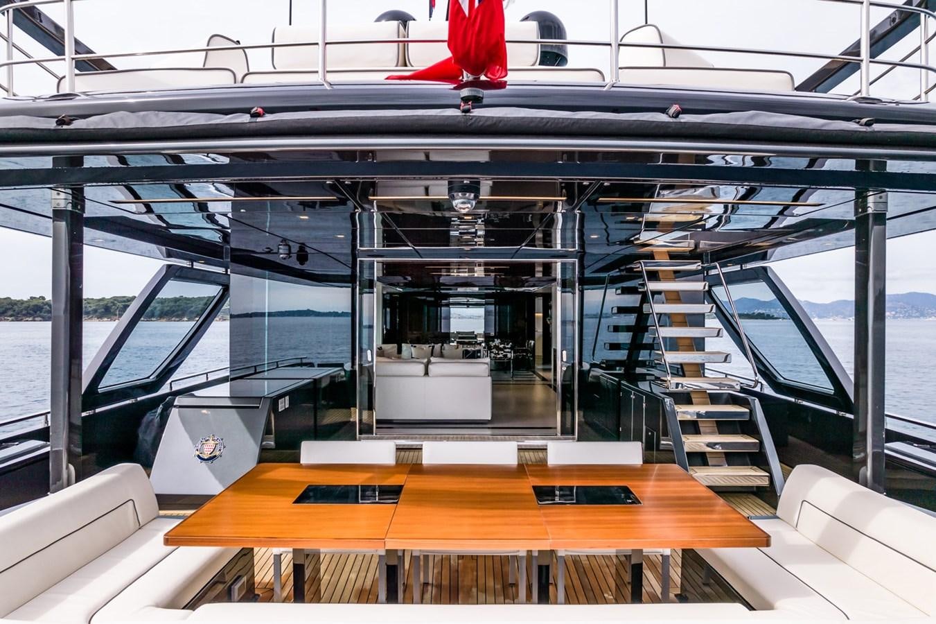 a room with a table and chairs aboard RIVA DOLCEVITA 110 Yacht for Sale