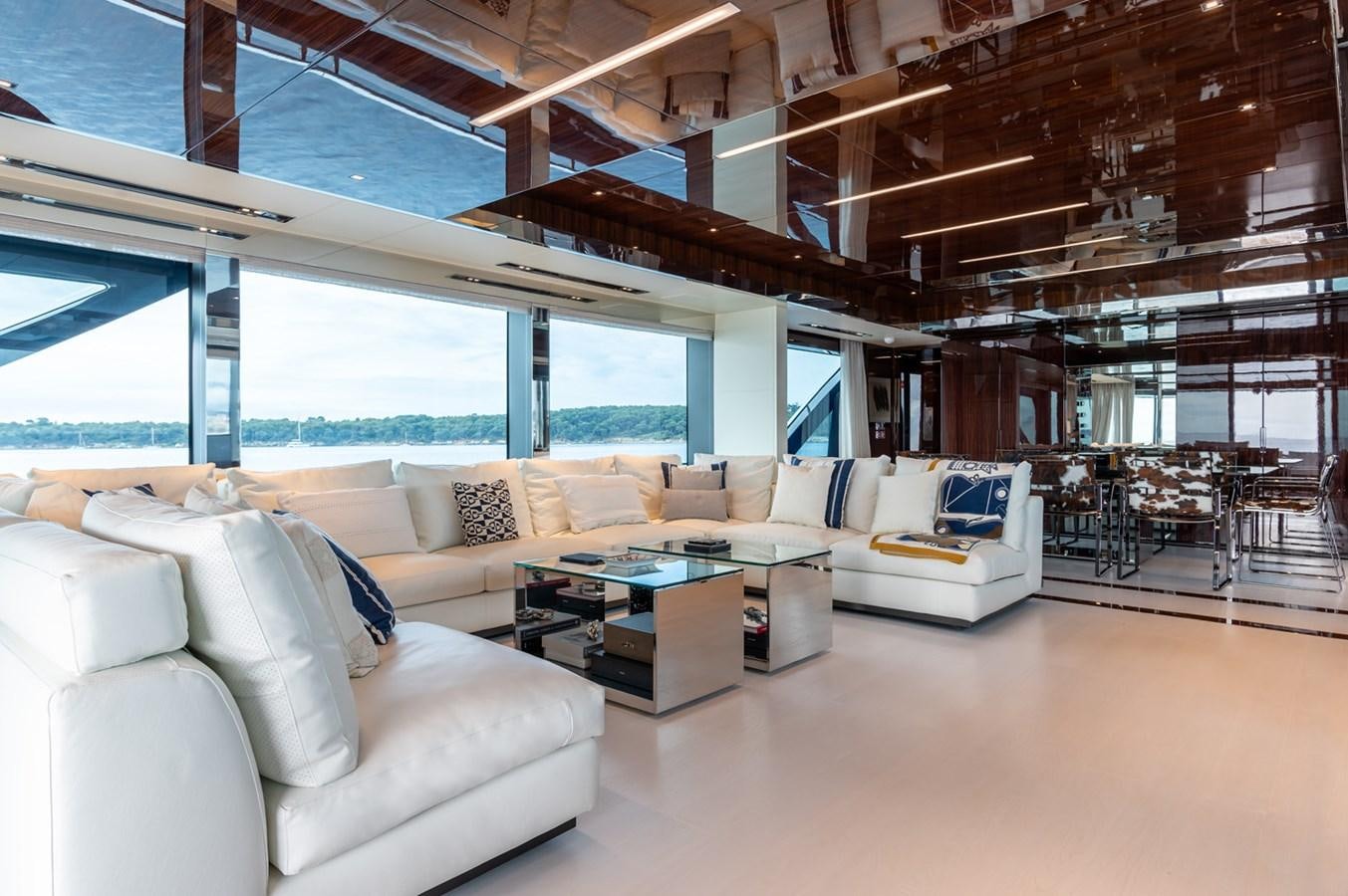 a living room with a large window aboard RIVA DOLCEVITA 110 Yacht for Sale