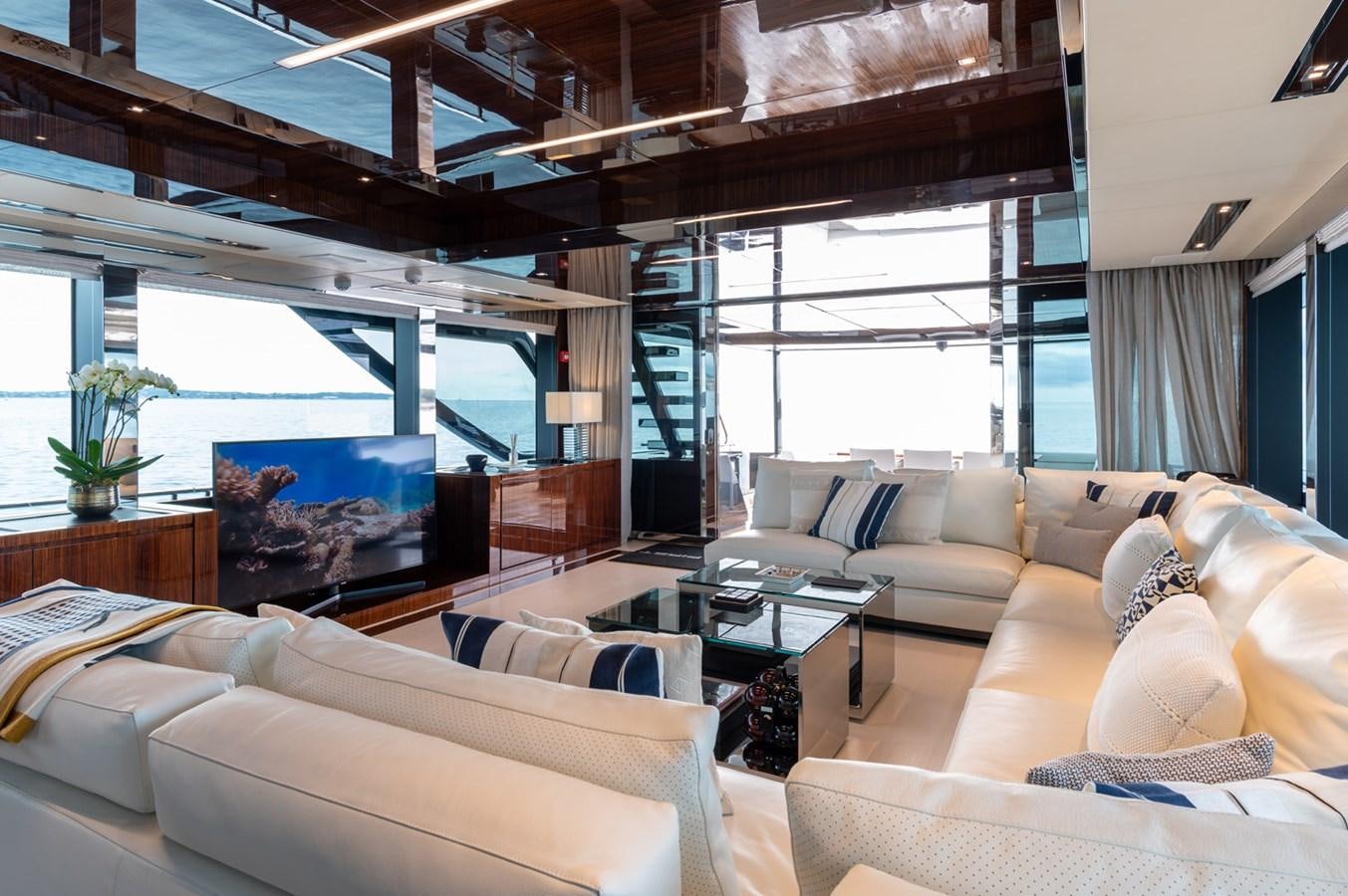a living room with a large window aboard RIVA DOLCEVITA 110 Yacht for Sale
