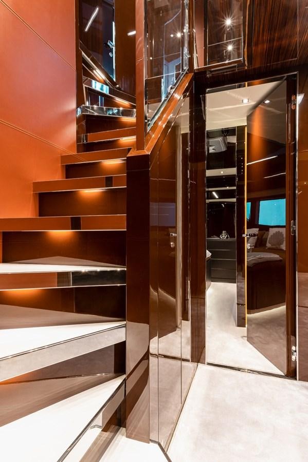 a room with a set of stairs aboard RIVA DOLCEVITA 110 Yacht for Sale