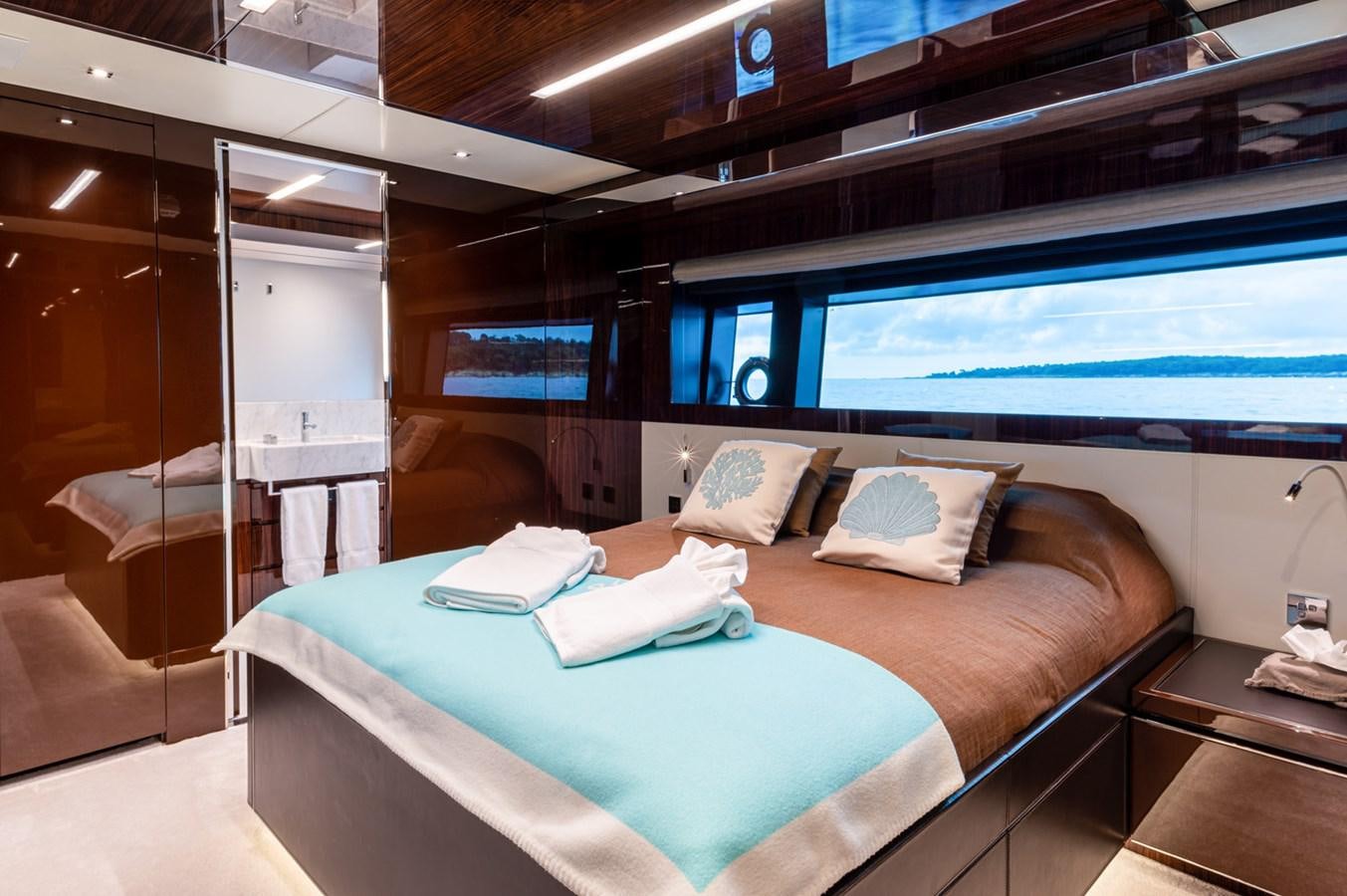 a bed in a room aboard RIVA DOLCEVITA 110 Yacht for Sale
