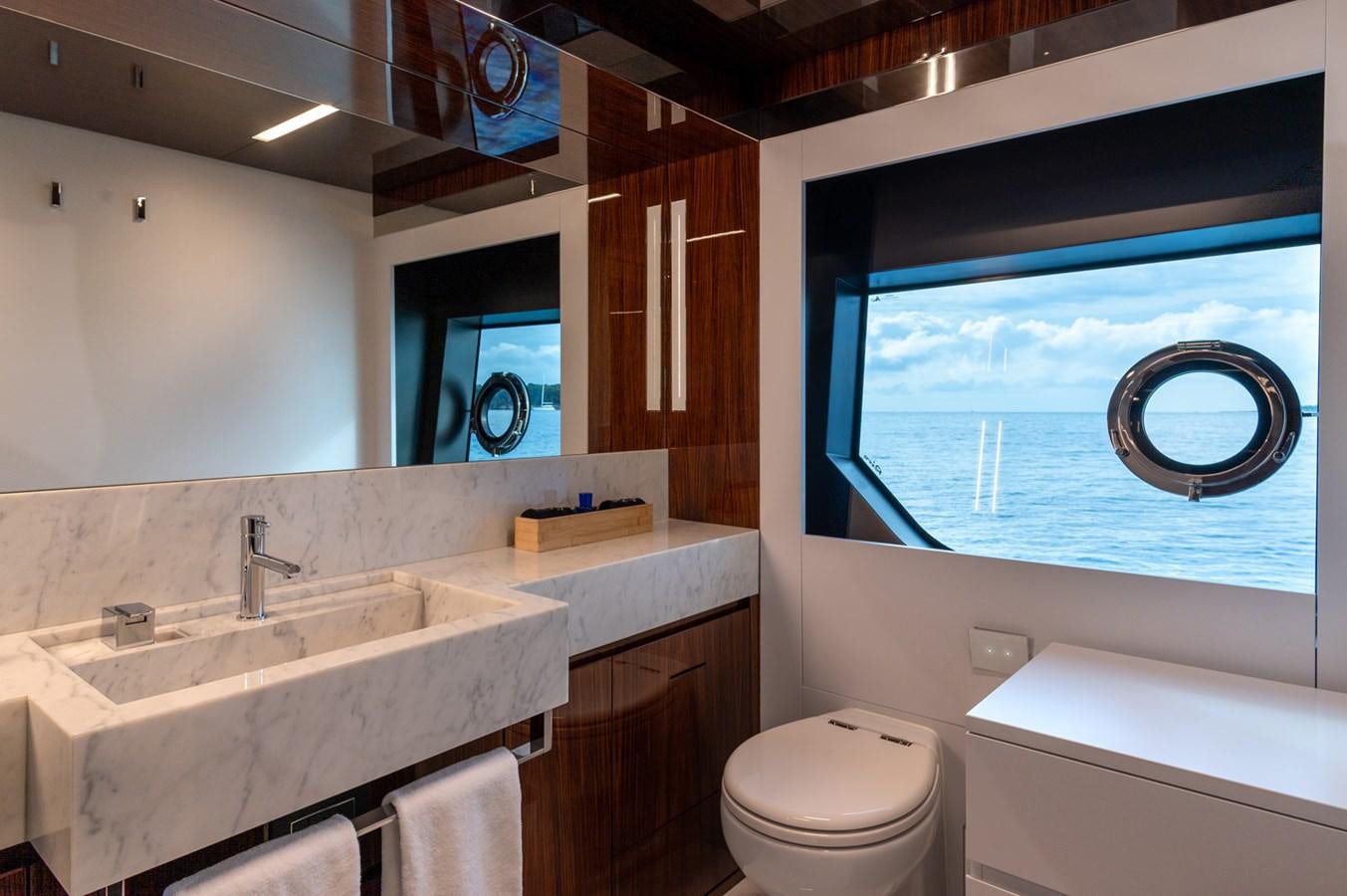 a bathroom with a sink and a toilet aboard RIVA DOLCEVITA 110 Yacht for Sale