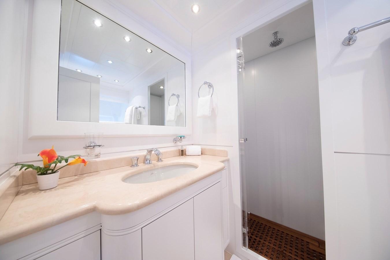 a bathroom with a large mirror aboard BIGCIKI Yacht for Sale