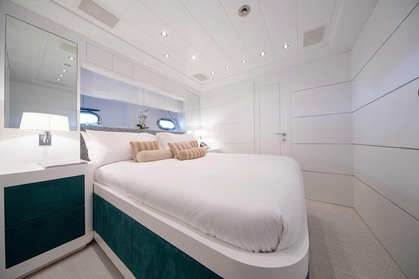 a room with a bed and a mirror aboard BIGCIKI Yacht for Sale