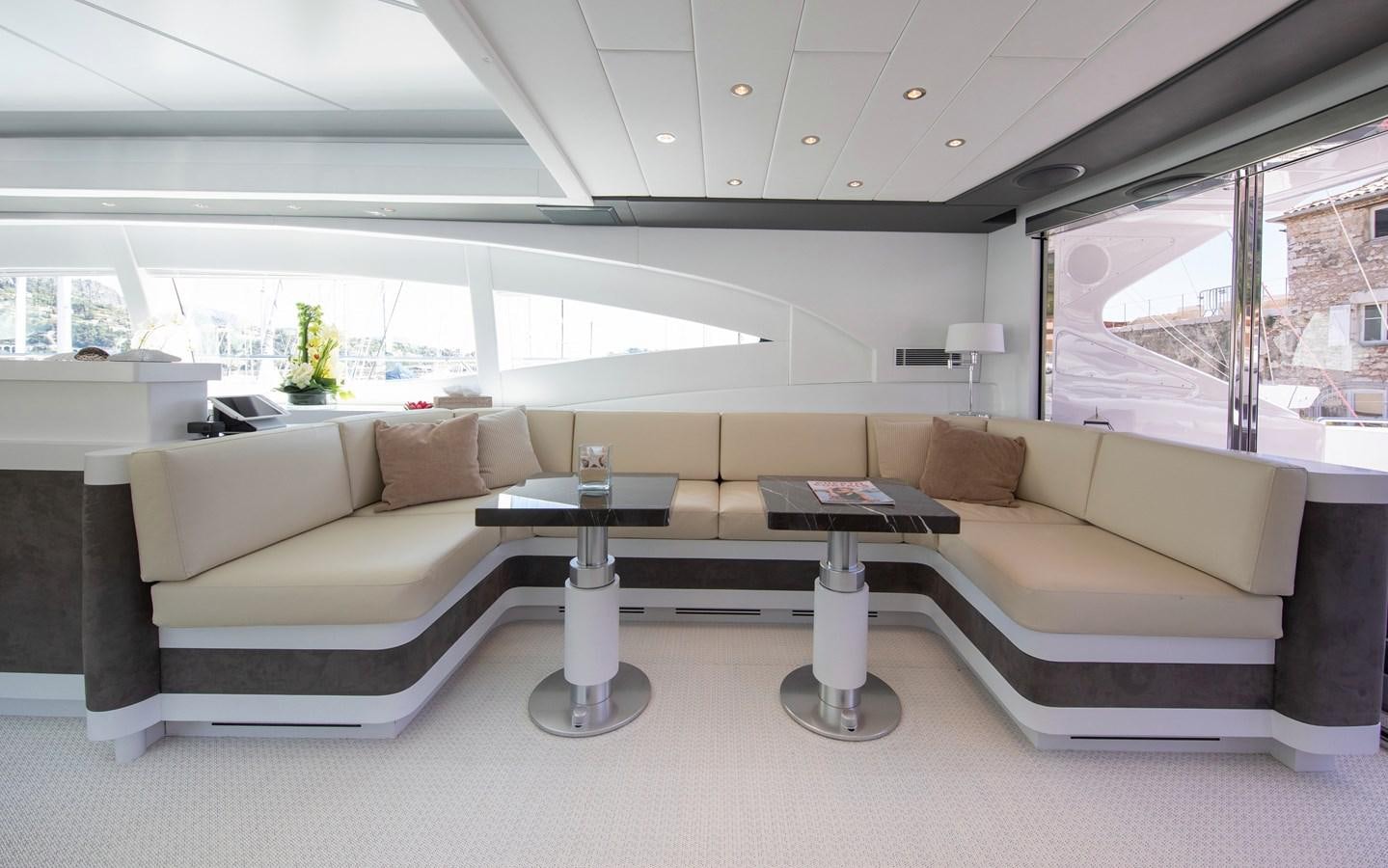 a living room with a couch and a table aboard BIGCIKI Yacht for Sale