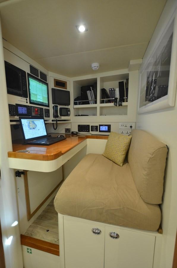 a laptop on a desk aboard DANNESKJOLD Yacht for Sale