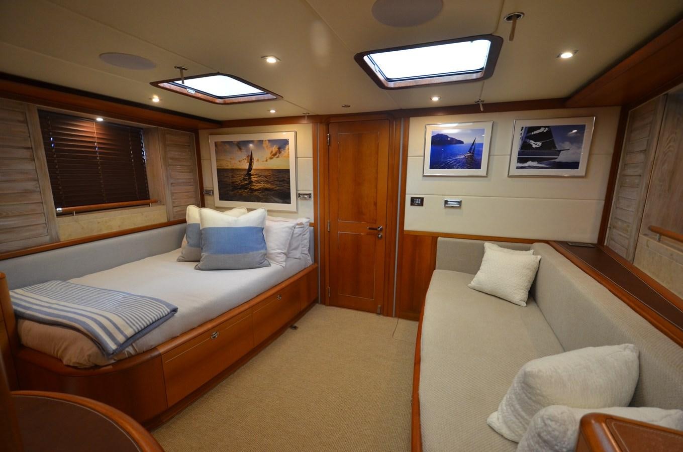 a room with a bed and a couch aboard DANNESKJOLD Yacht for Sale