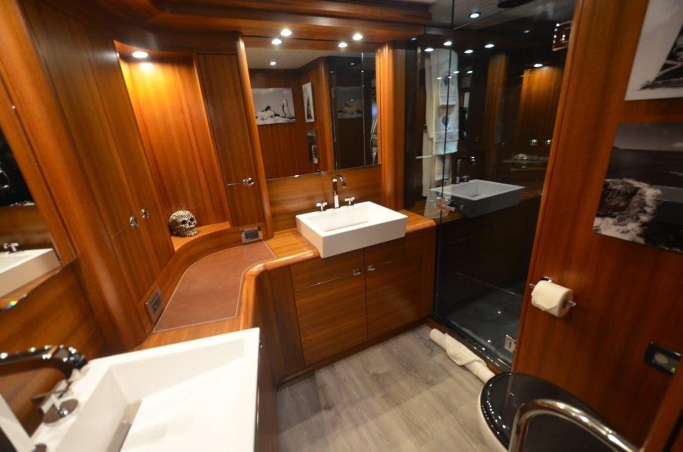 a bathroom with a large mirror aboard DANNESKJOLD Yacht for Sale