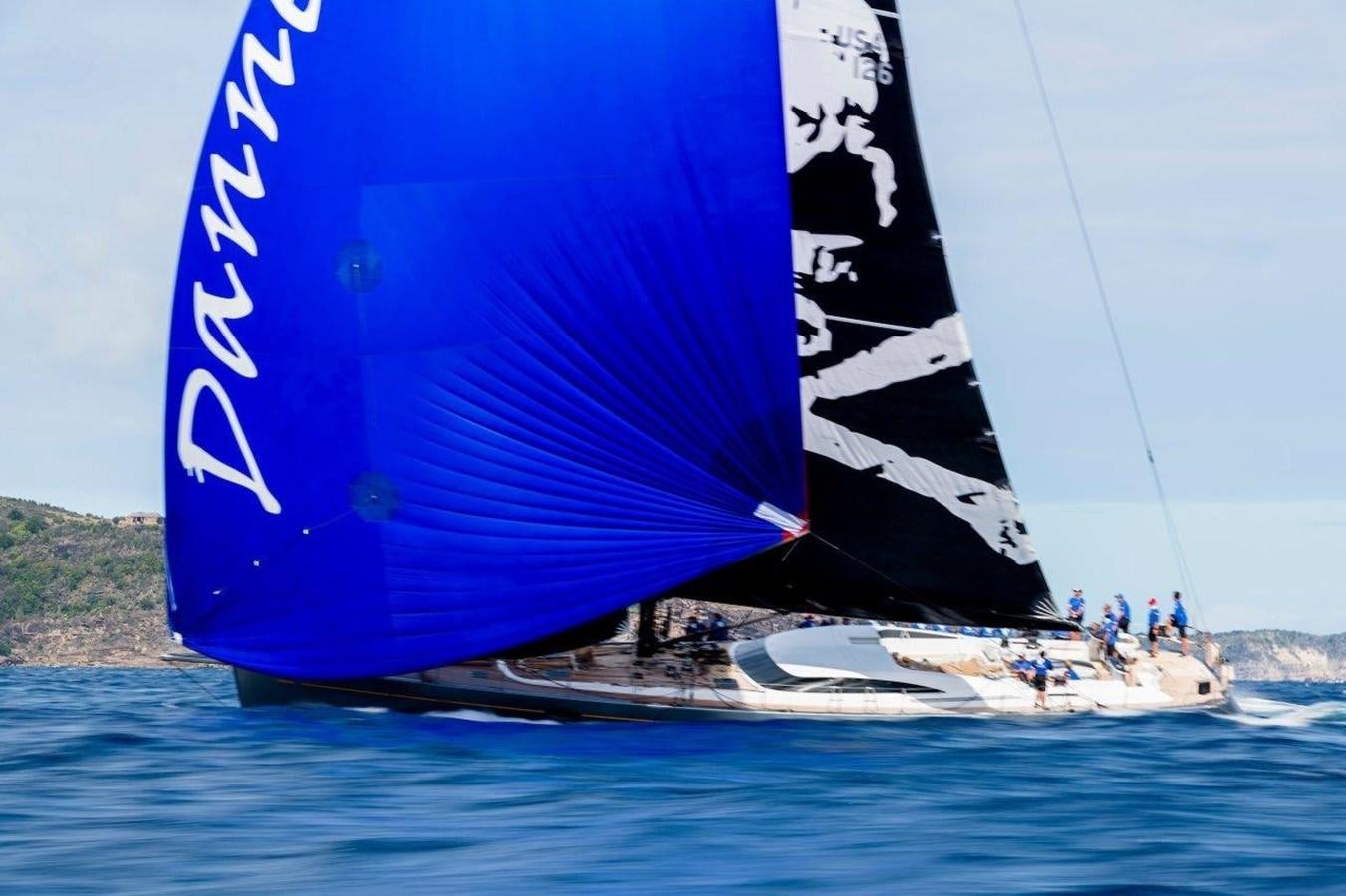 a group of people sailing on a sailboat aboard DANNESKJOLD Yacht for Sale