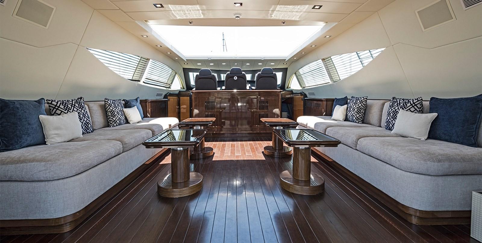 a living room with a couch and a coffee table aboard GLESS Yacht for Sale