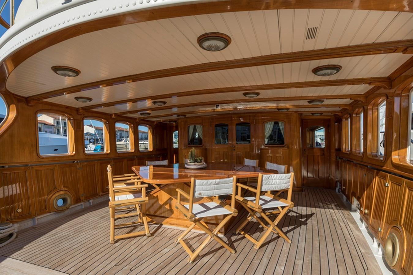 a room with wooden furniture aboard LADY MAY OF GLANDORE Yacht for Sale